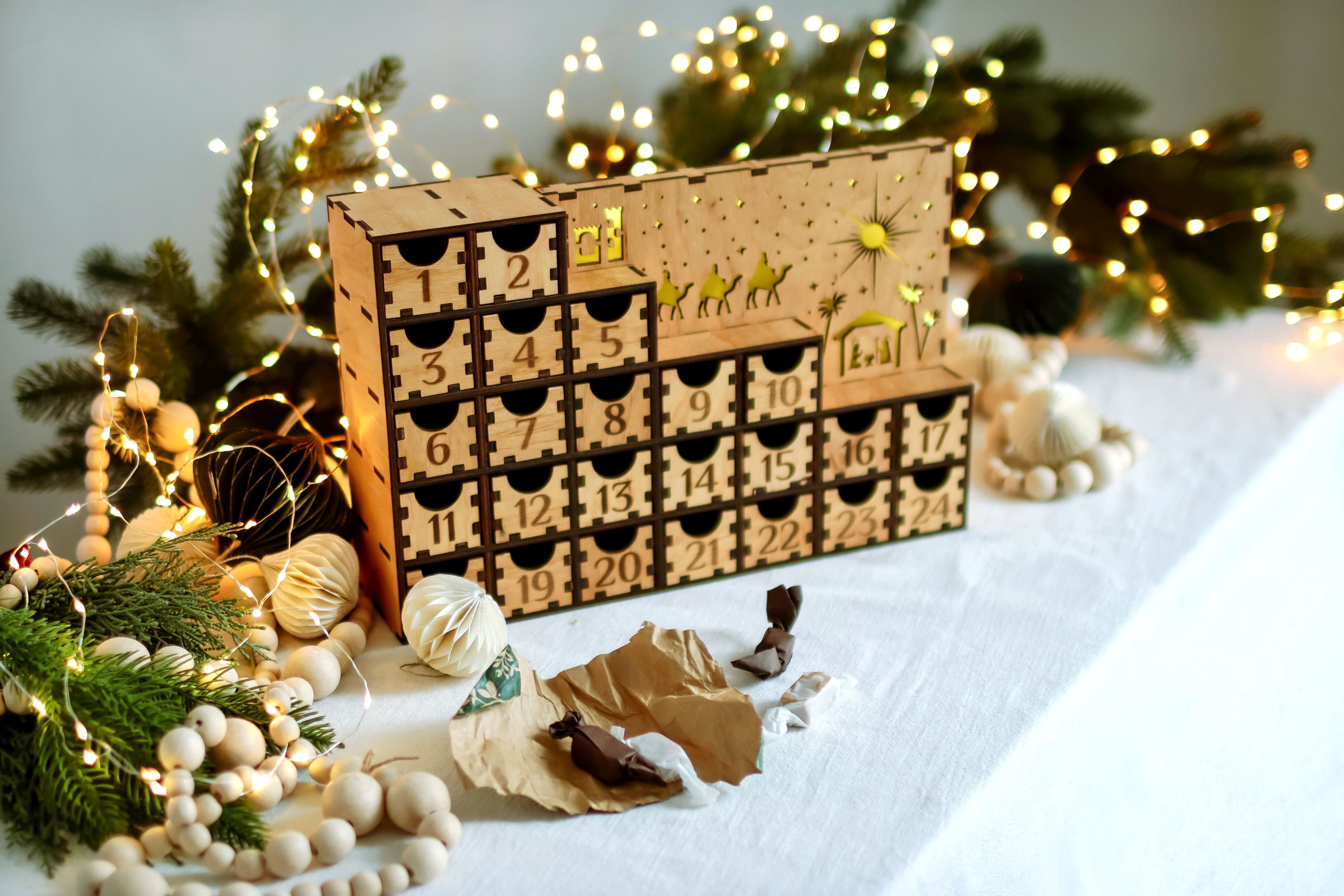Beautiful handmade wooden advent calendar with pull-out drawers and ambient lighting, perfect for counting down to Christmas and enhancing holiday decor. And creative designed key holder