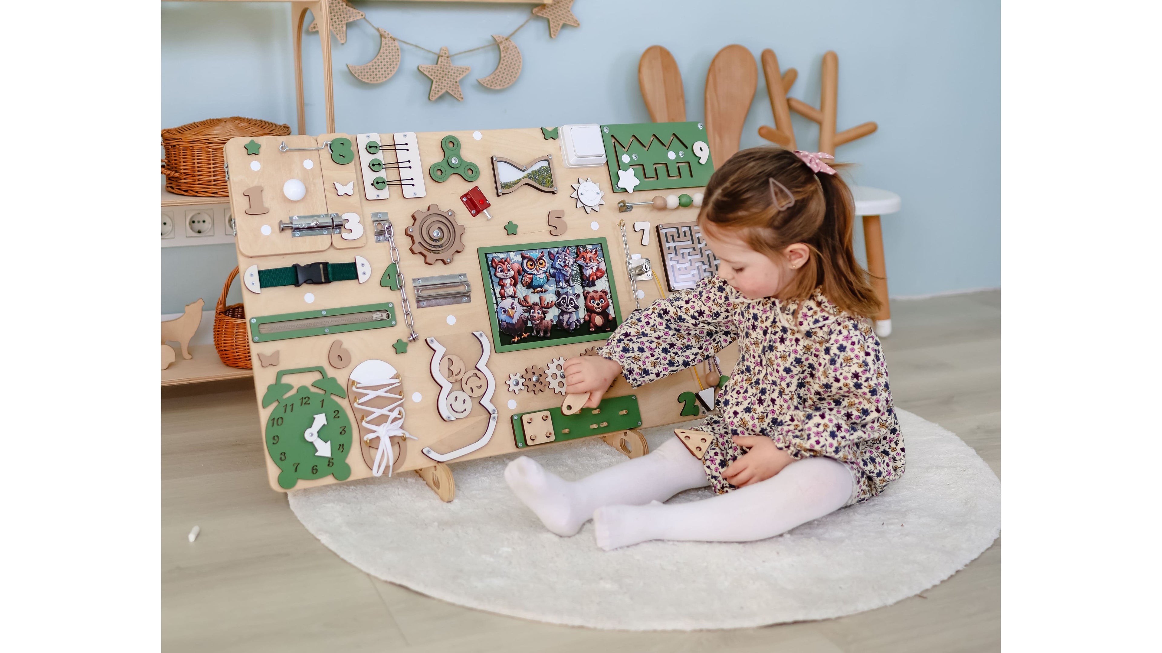 Handmade animated busy boards for toddlers featuring animals and colorful themes