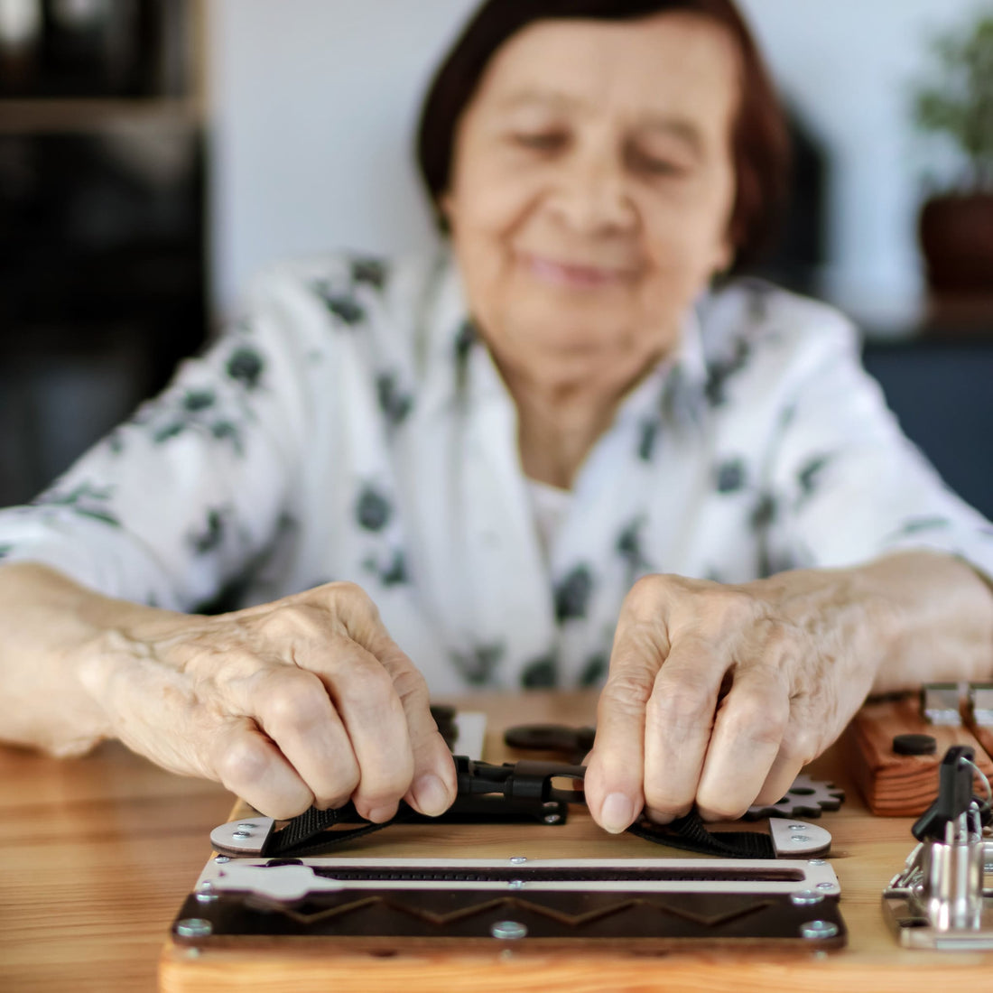 A hands-on busyboard designed for cognitive rehabilitation, featuring interactive locks, gears, and textures to support dementia and autism therapy