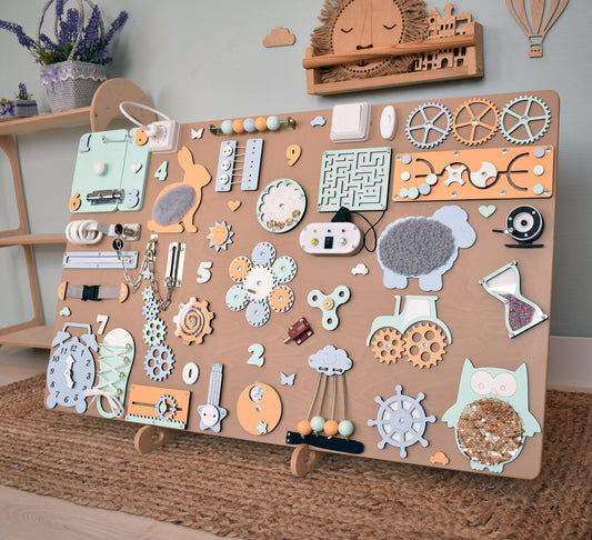 Commercial busy board installed on wall in kids play area for business improving customer experience and engagement