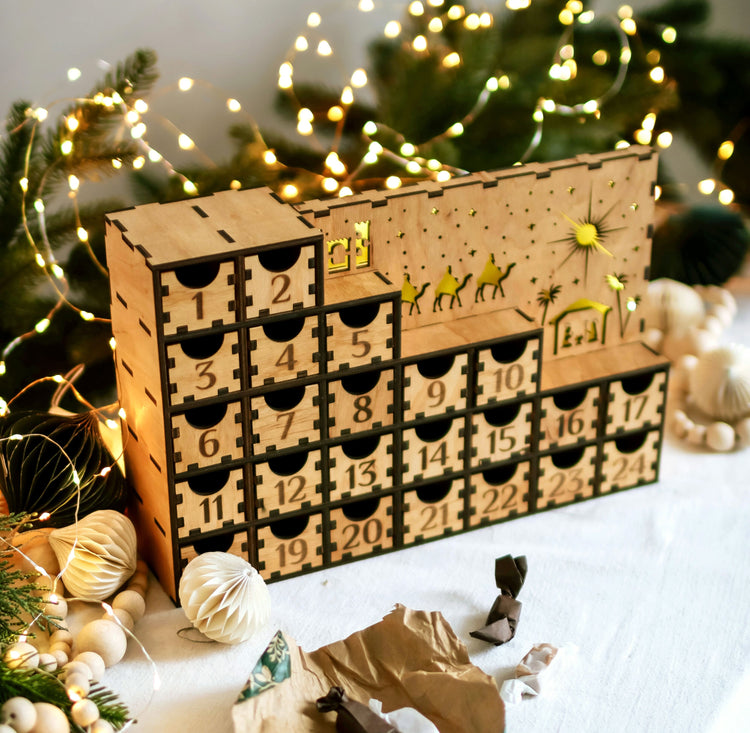 Beautiful handmade wooden advent calendar with pull-out drawers and ambient lighting, perfect for counting down to Christmas and enhancing holiday decor