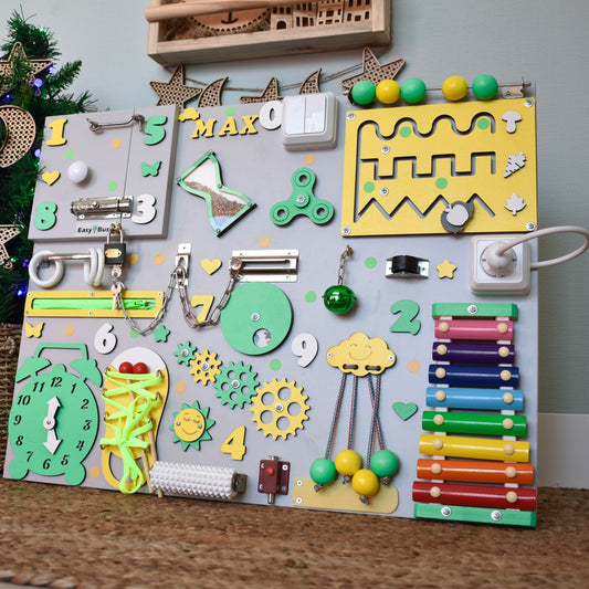 Montessori busy board with green and yellow design