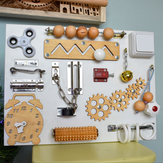 White busy board with natural wood gears and bell for toddlers