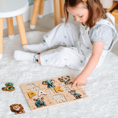Montessori name puzzle with lion, elephant, and zebra