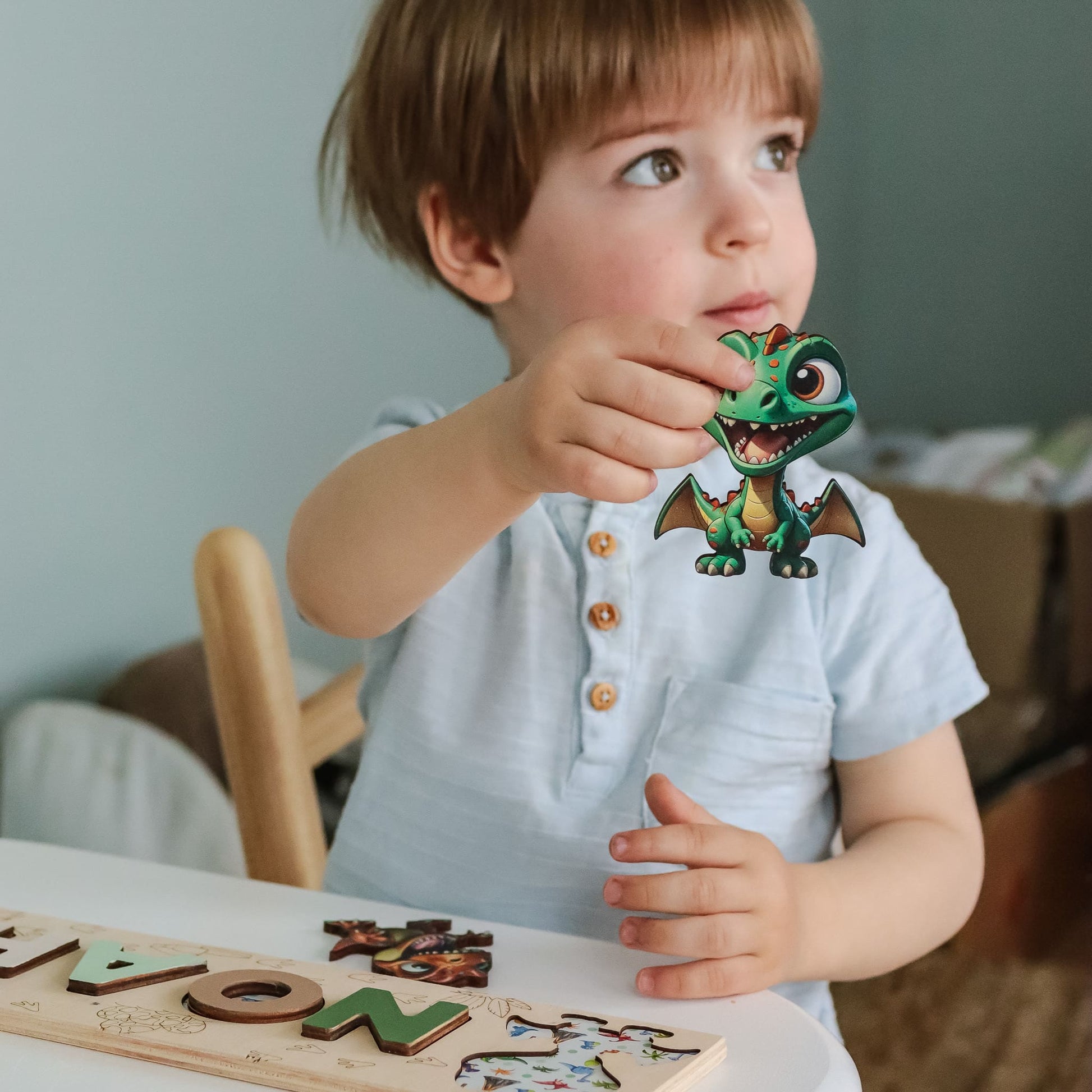 Wooden name puzzle with triceratops and volcano engraving