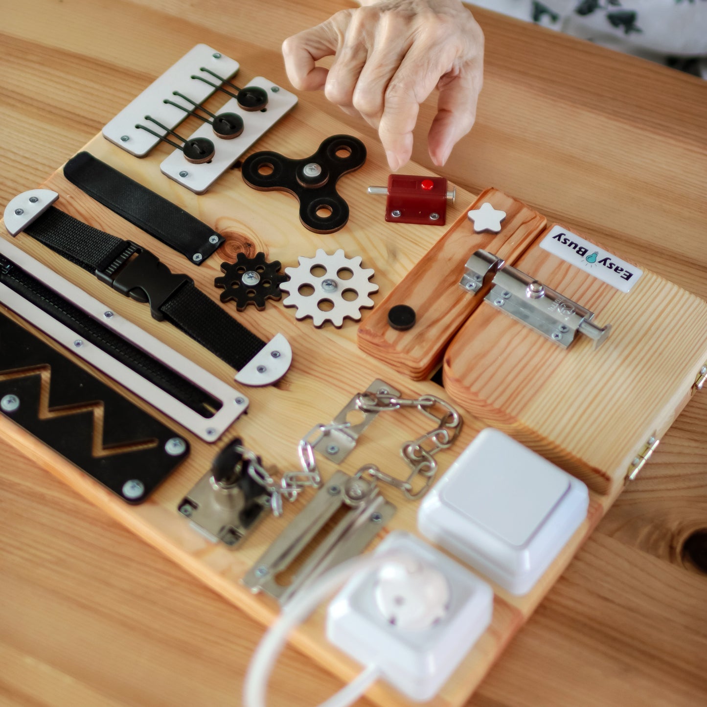 S Size Busy Board in Use by Elderly Person – An elderly individual interacting with the small dementia care board, demonstrating its ease of use