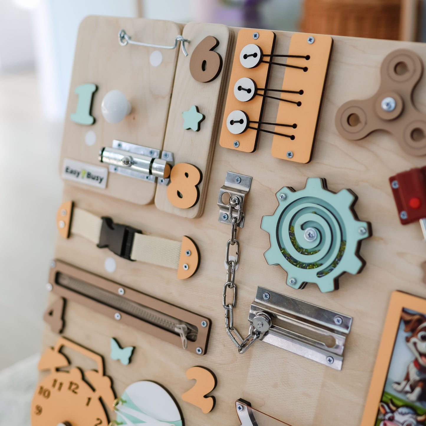 Interactive barnyard busy board featuring removable magnetic animals
