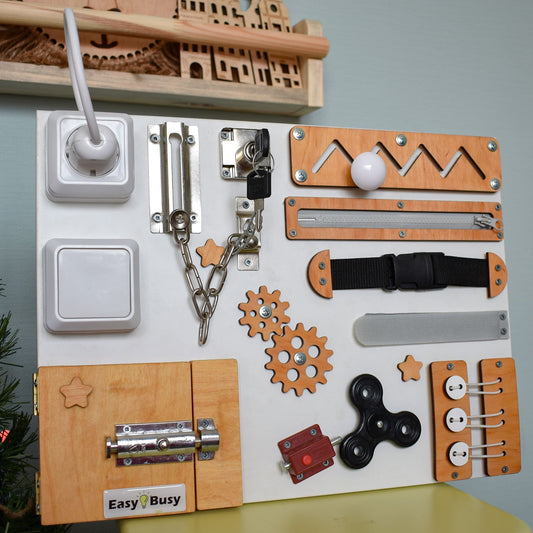 Montessori busy board in white and wood with black fidget spinner