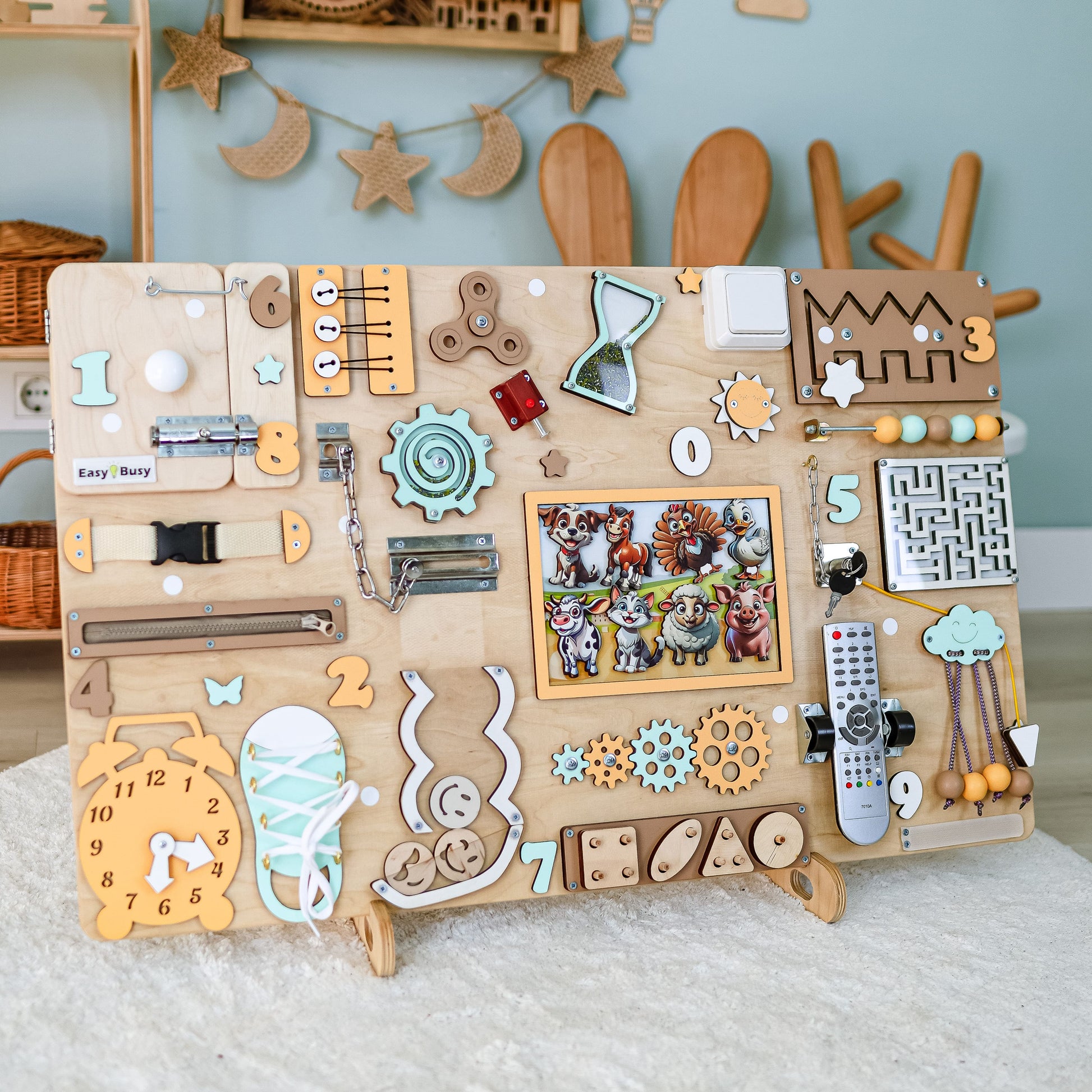Toddler exploring a large educational farm-themed activity board