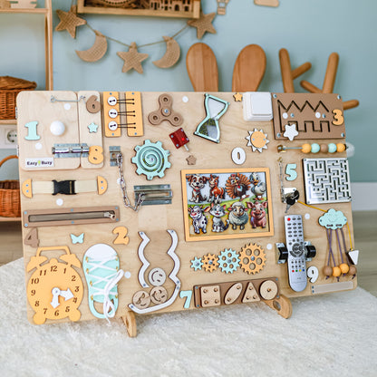 Toddler exploring a large educational farm-themed activity board
