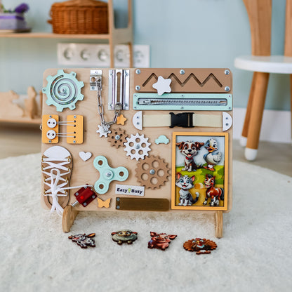 Toddler arranging magnetic farm animals on an interactive activity board