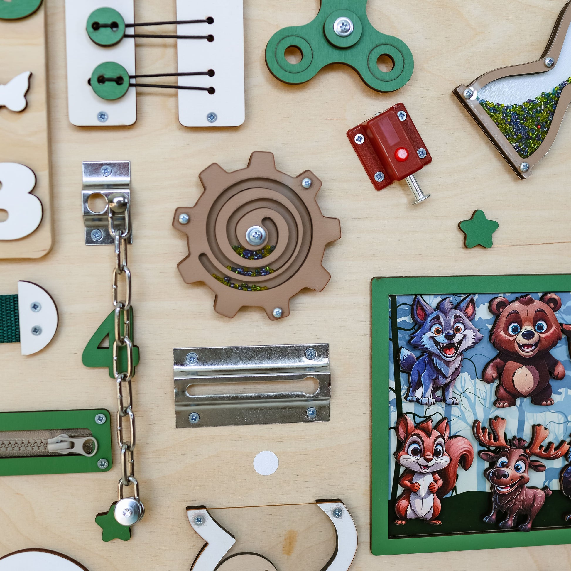 Handmade wooden busy board featuring a detailed woodland scene