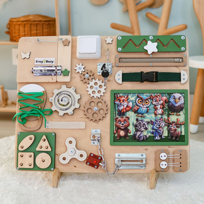 Magnetic owl and deer on a sensory play activity board