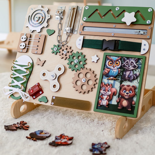 Woodland-themed animated busy board with magnetic forest animals