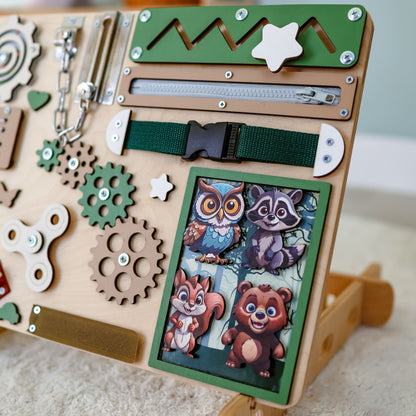 Montessori sensory board featuring an interactive nature scene