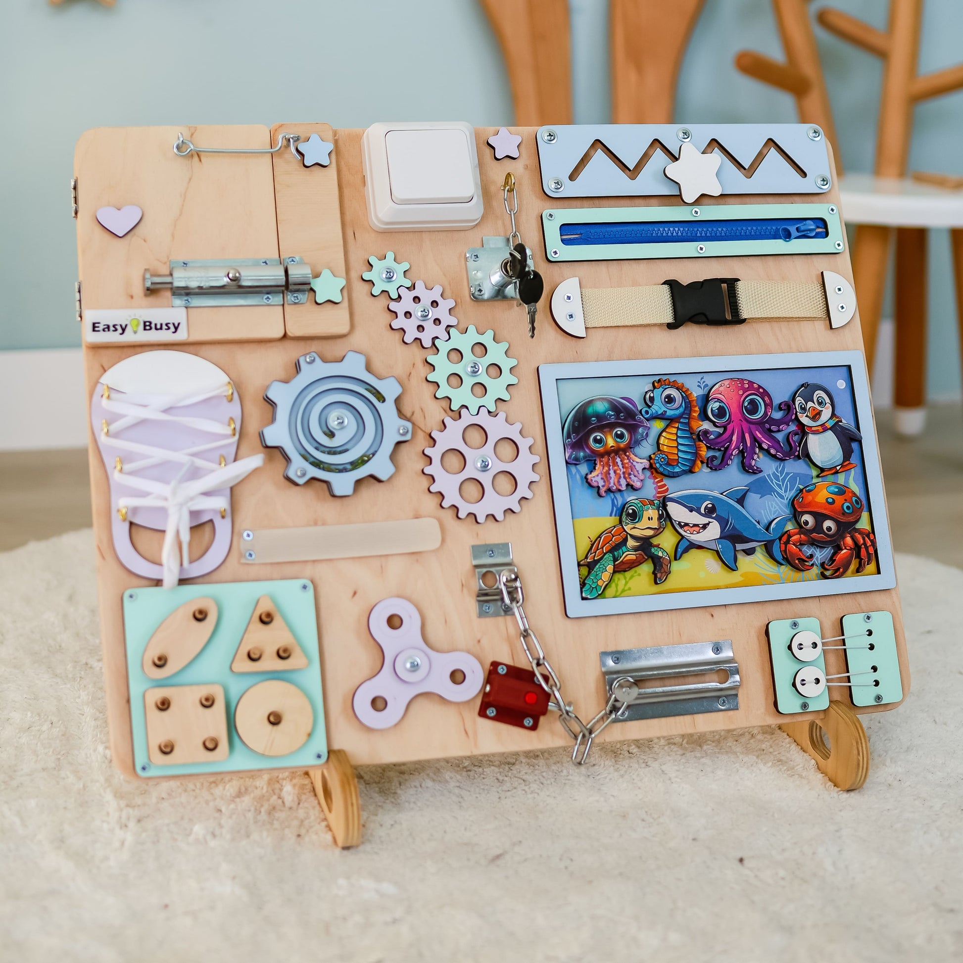 Handmade ocean-themed Montessori activity board with removable magnetic animals
