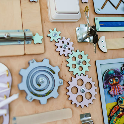 Montessori-inspired sensory board featuring whales, octopuses, and starfish