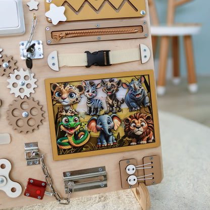 Montessori sensory play board featuring lions, zebras, and elephants