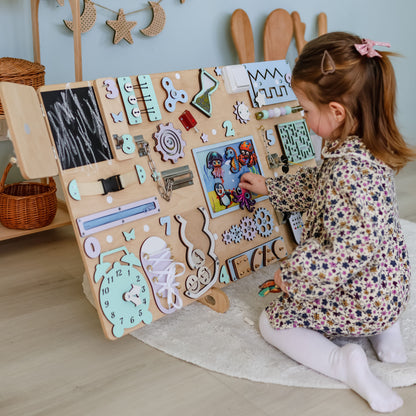 Montessori-inspired sensory board featuring jellyfish, stingrays, and starfish