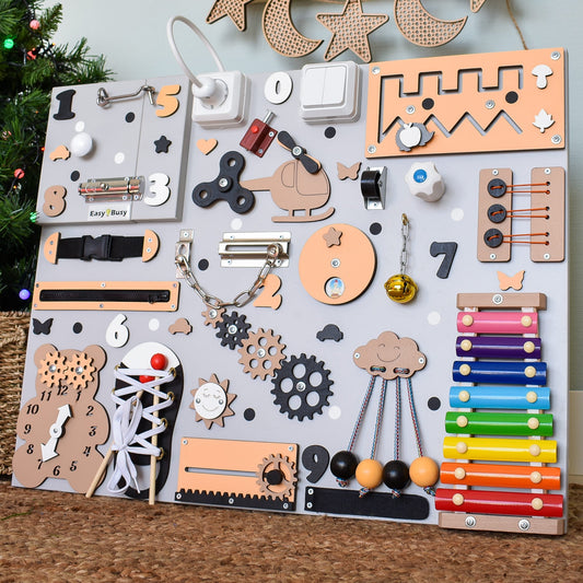 Peach-colored sensory board with rotating gears and locks
