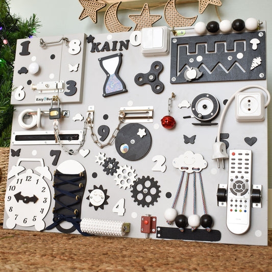Busy board featuring real switches, zippers, and clock