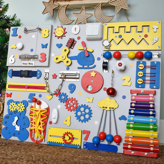 Montessori activity board with musical xylophone and gears