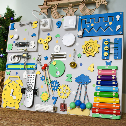 Sensory learning board with spinning gears and switch