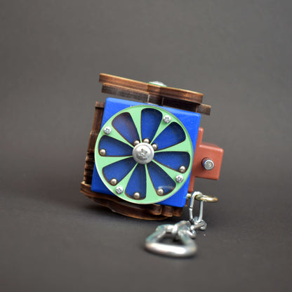 Fine motor toy with maze and slider