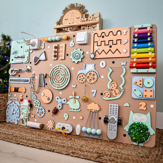 A detailed view of the 39.4x23.6-inch handmade interactive busy board for toddlers, showcasing multiple activities and a glowing light module