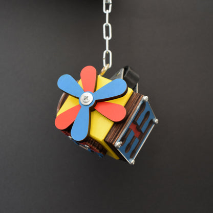 Miniature cube toy with pastel sun design