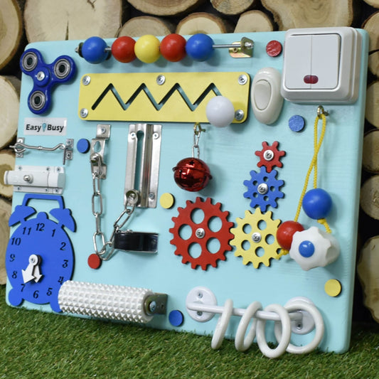 Pastel busy board for toddlers with pink gears and clock