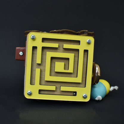 Small wooden activity cube for toddlers