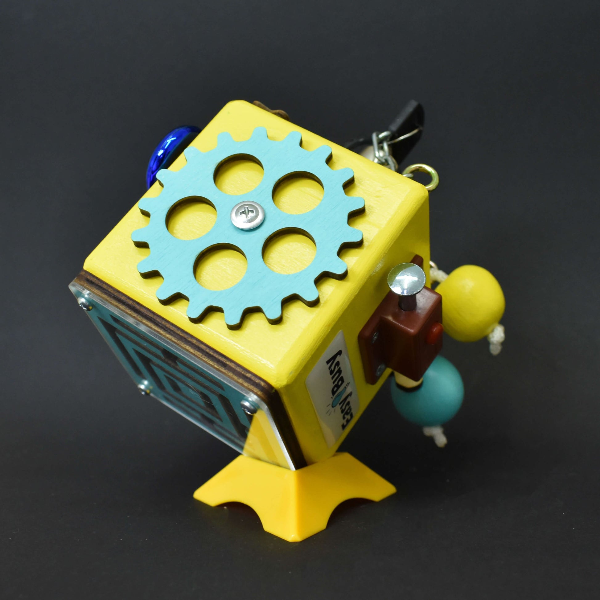 Educational busy cube with gears and labyrinth