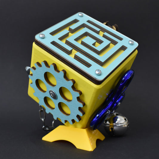 Robot-themed busy cube with gears and caster