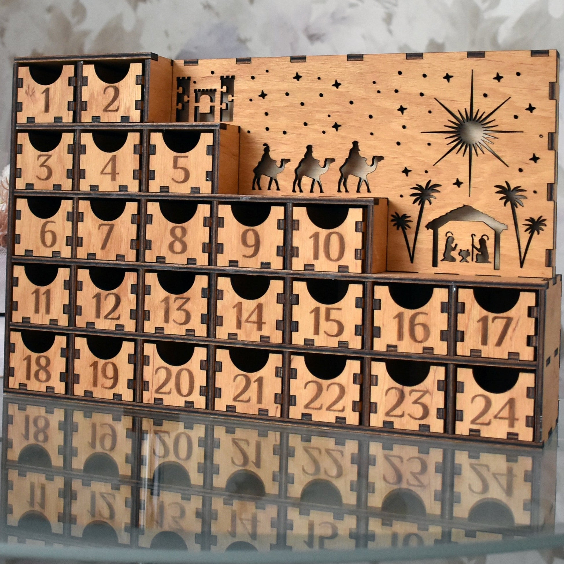 Advent Calendar Next to a Christmas Tree – A beautifully styled shot of the Advent calendar placed next to a decorated Christmas tree, enhancing the festive atmosphere