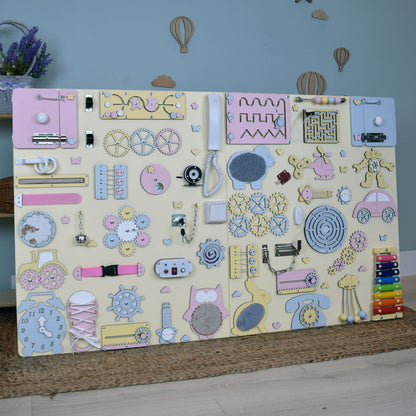 Wall-mounted sensory activity board for commercial spaces and waiting rooms