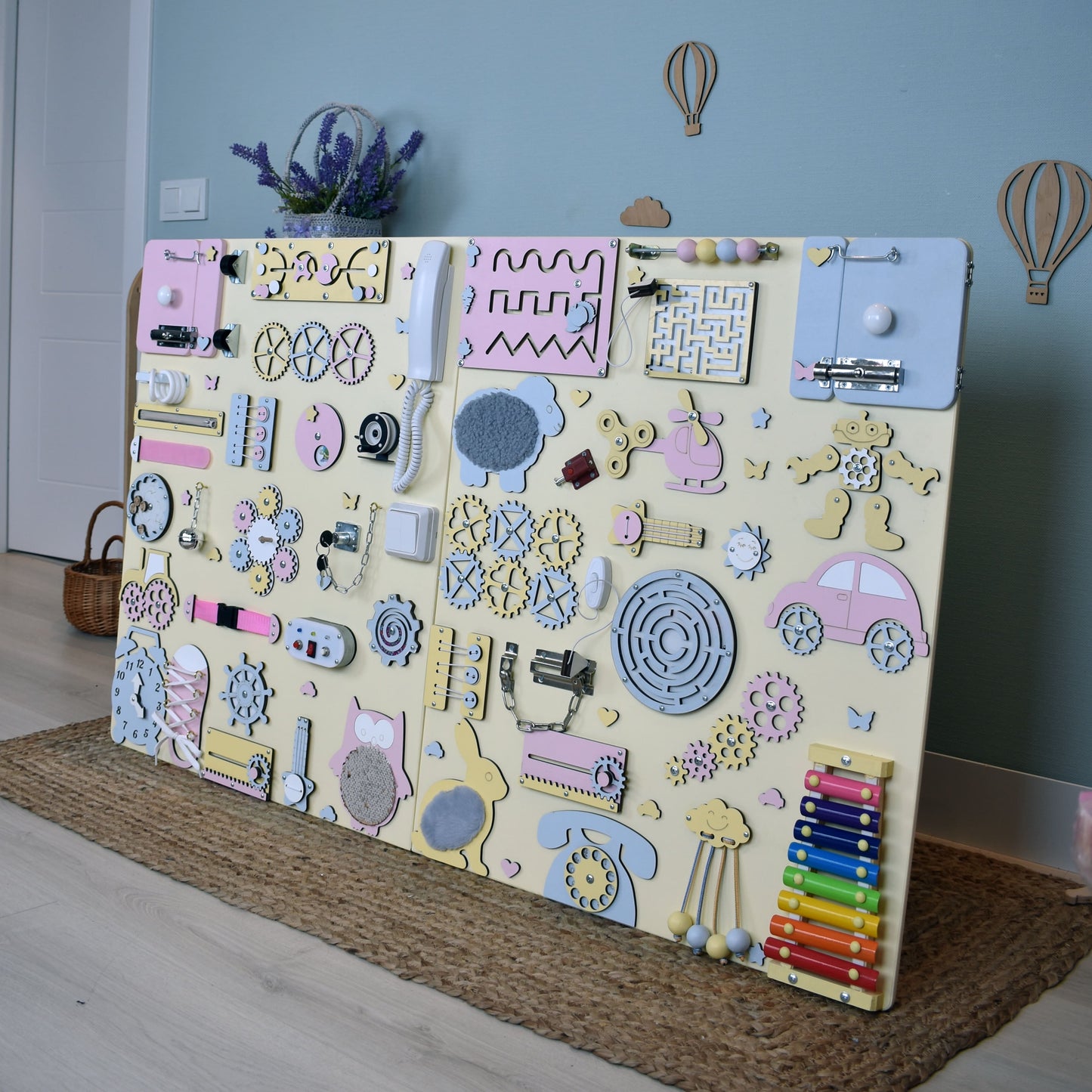Interactive busy board installed in a clinic waiting room for children