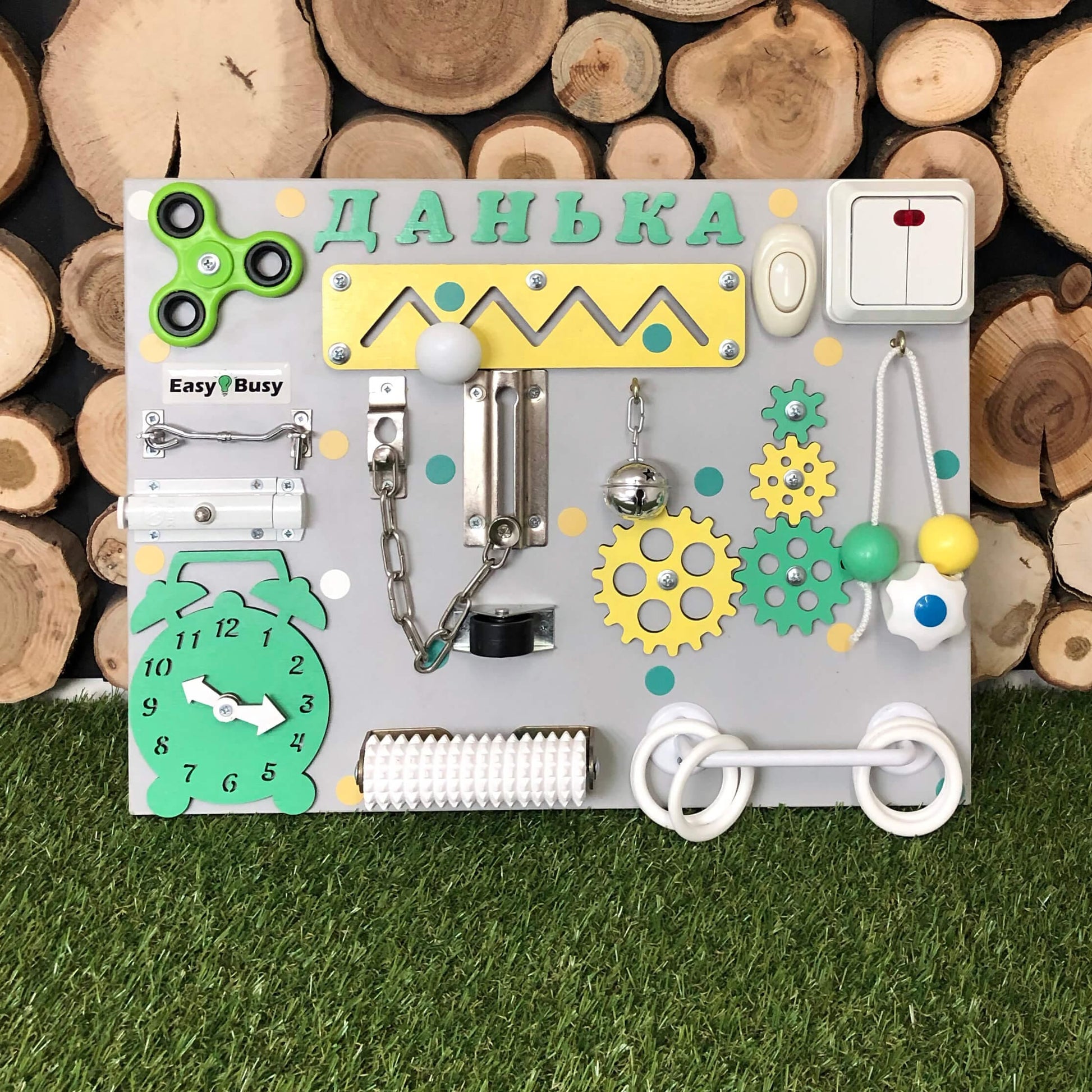 Compact activity board with white rotary switch and ring pull