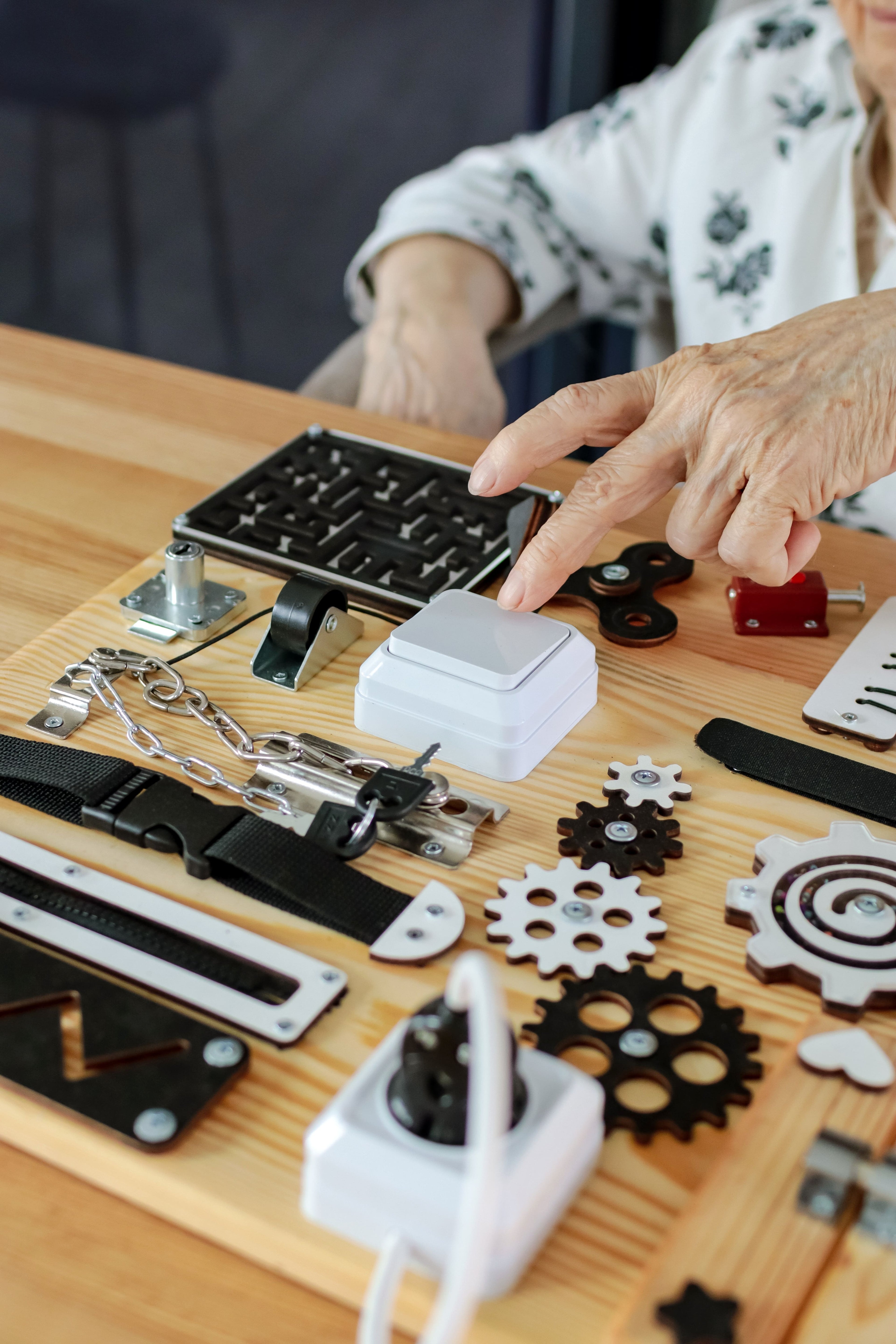 Handmade busyboard for dementia and Alzheimer’s care, designed to improve cognitive skills, provide therapy, and reduce anxiety through interactive elements