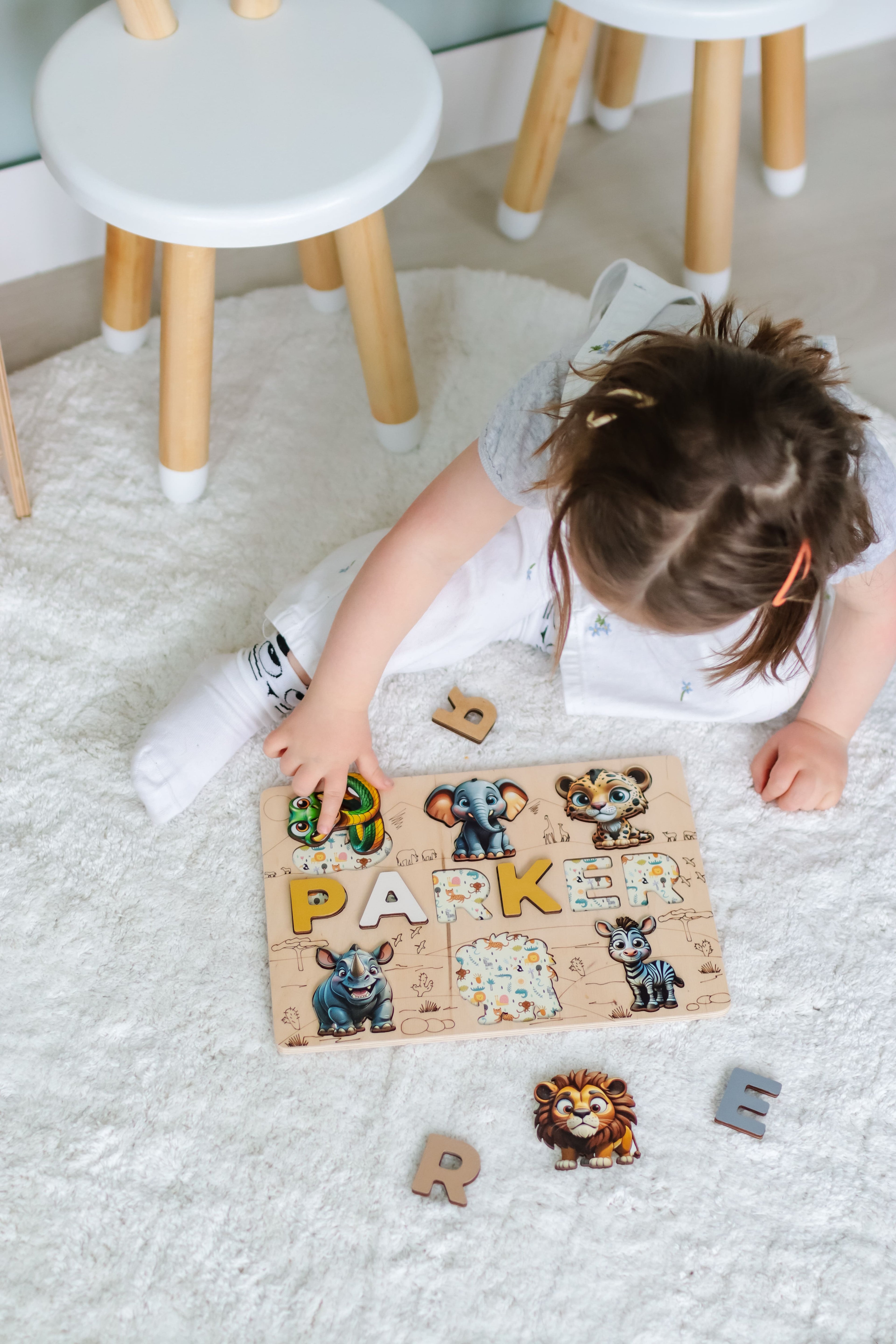 Custom wooden name puzzle for toddlers, designed to help children learn letters and develop fine motor skills while having fun