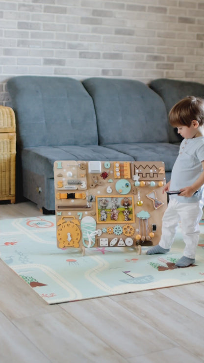 Toddler engaging with a Montessori-inspired farm sensory play board