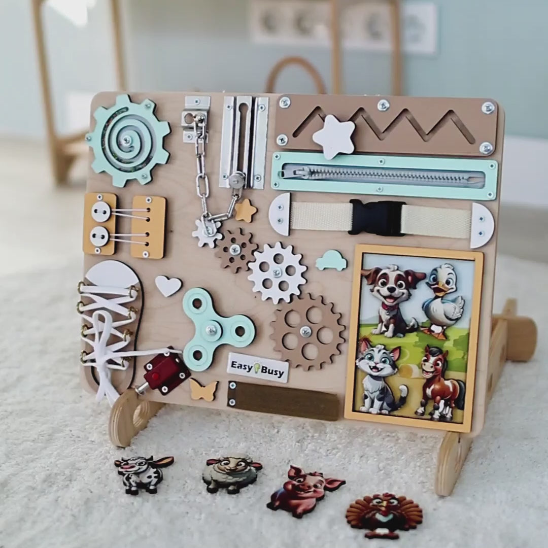 Toddler playing with a Montessori-inspired farm sensory play board