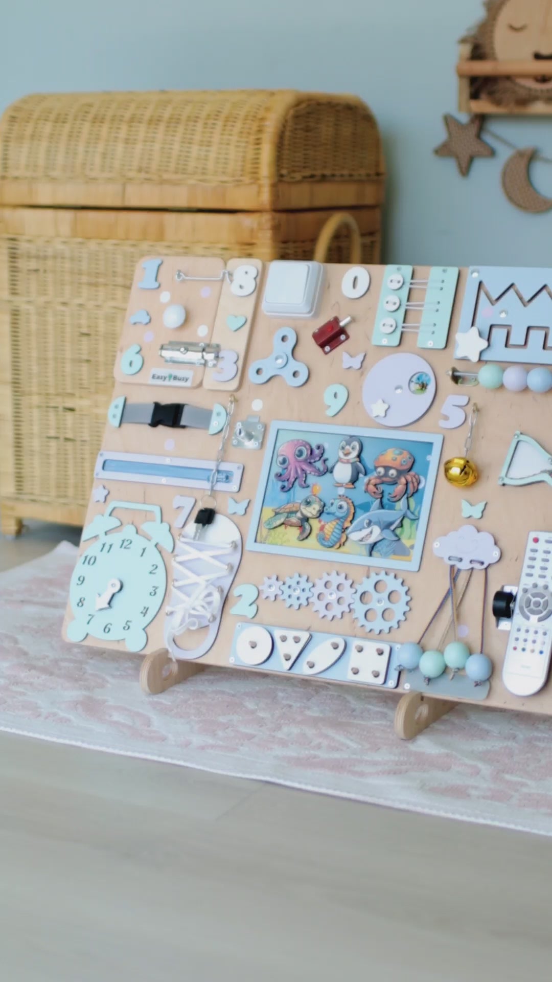 Close-up of removable magnetic fish, stingrays, and crabs on a wooden busy board