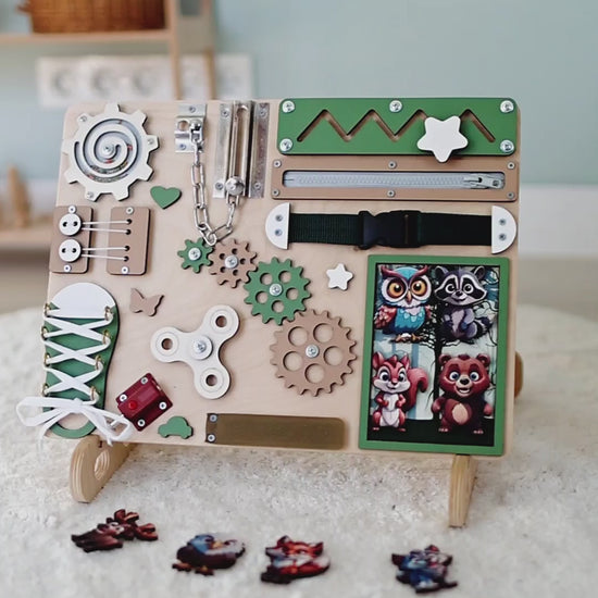 Toddler playing with Montessori-inspired forest busy board